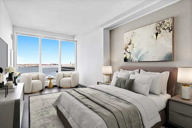 a bedroom with bed and cupboard