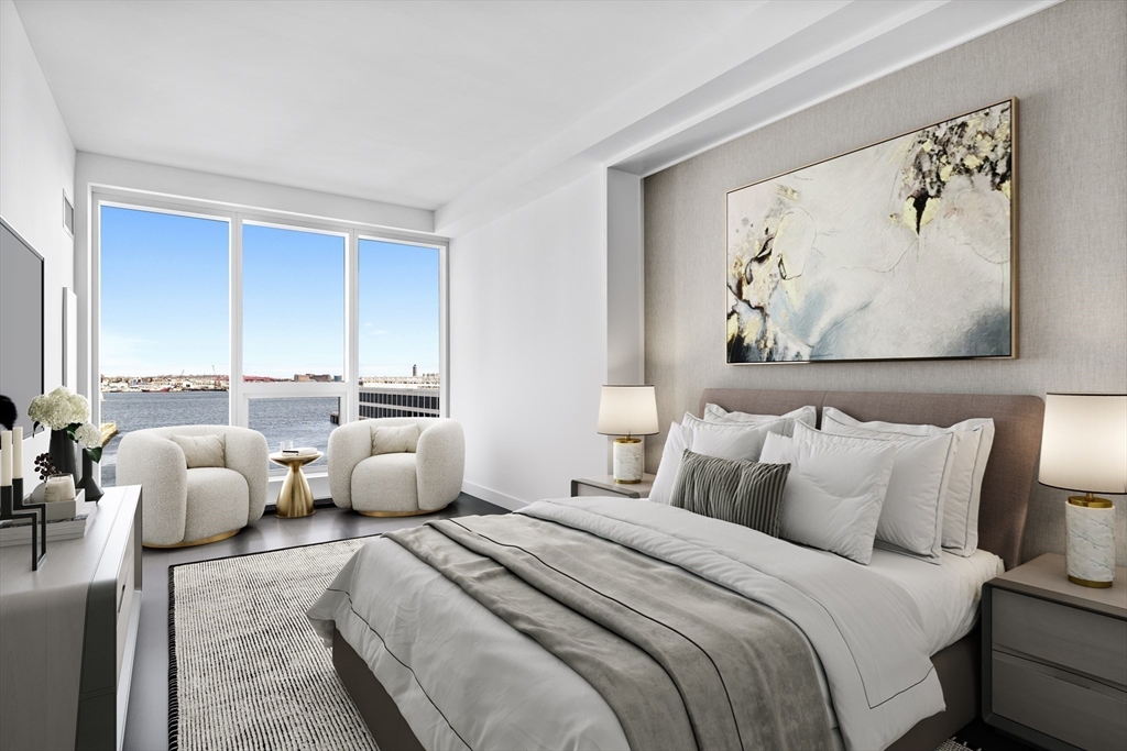 a bedroom with bed and cupboard