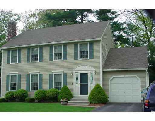 a view of a yard in front of a brick house