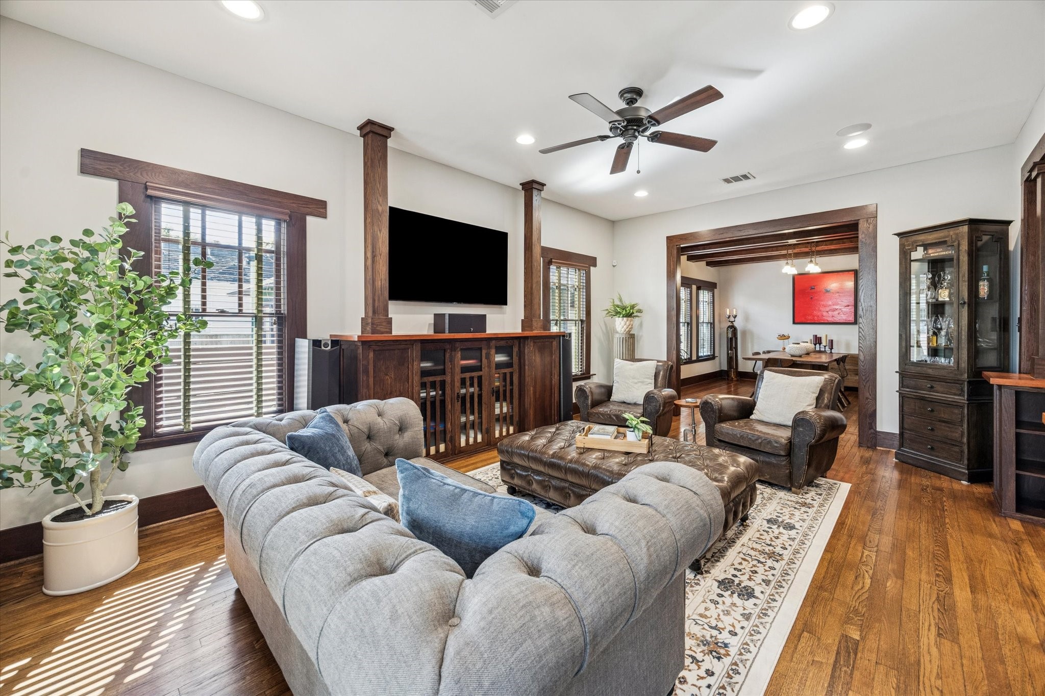 512 Archer Street Houston, TX 77009 - Photo 4 of 40 The living room showcases the Craftsman-style wood sills and head casings around the windows and doors, adding timeless character and architectural detail.