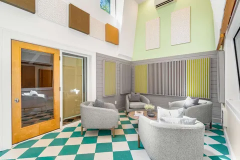 a living room with furniture and a rug