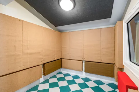 a view of a room with window and stainless steel appliances