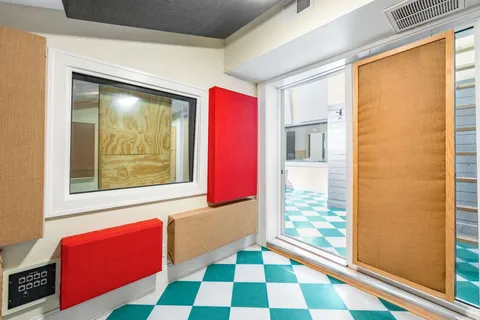 a view of a room with window and stairs