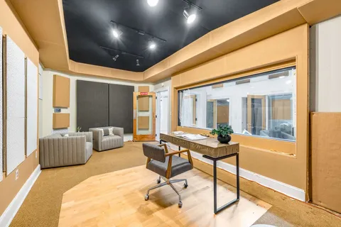 a living room with furniture and a table