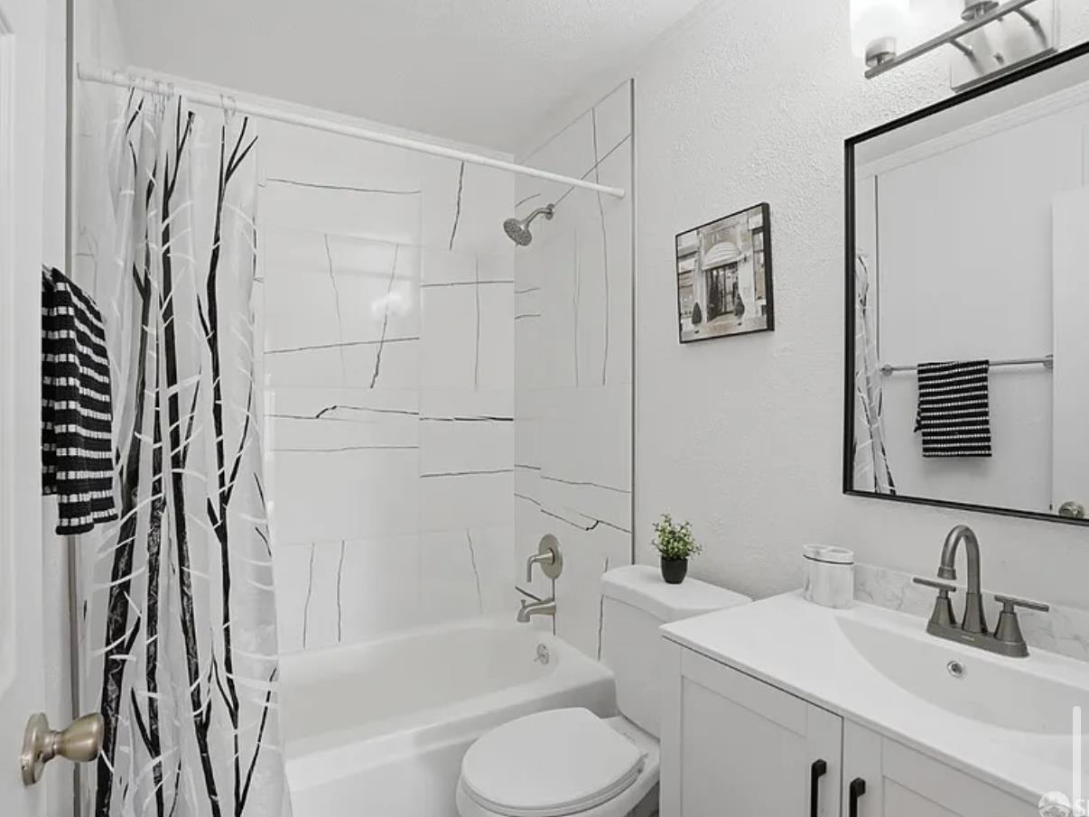 4081 Clayton Road, Unit 235 Concord, CA 94521 - Photo 14 of 19 a bathroom with a sink toilet and shower