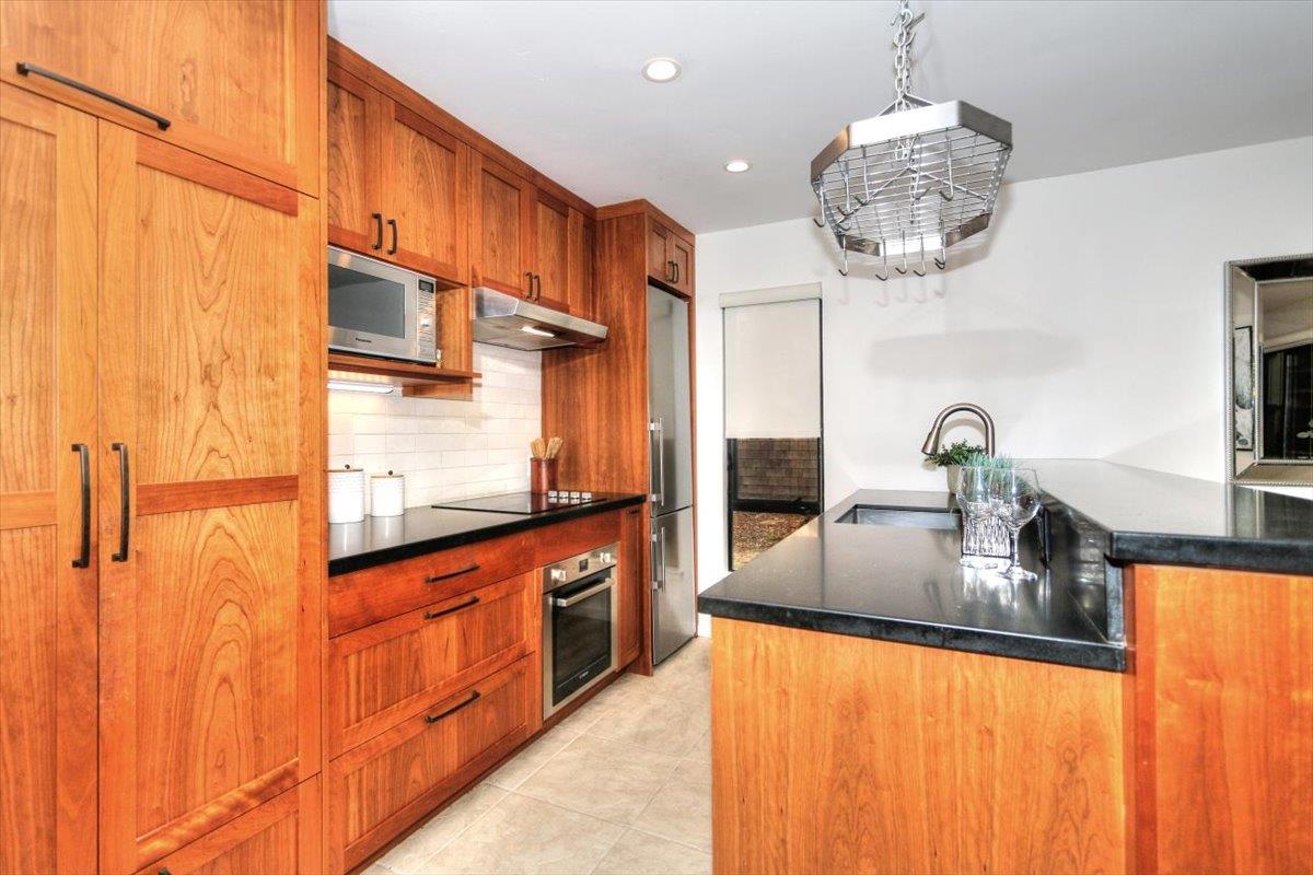 73 Pearce Mitchell Place Stanford, CA 94305 - Photo 7 of 17 a kitchen with stainless steel appliances granite countertop a sink and cabinets