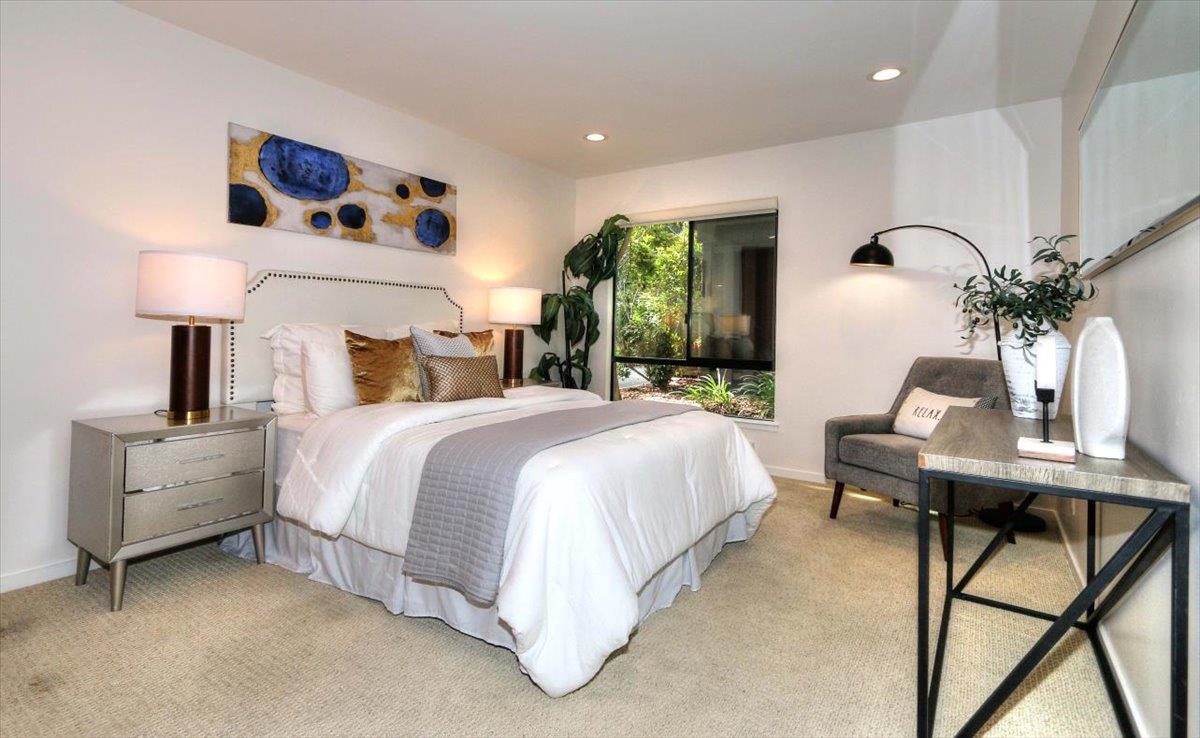 73 Pearce Mitchell Place Stanford, CA 94305 - Photo 9 of 17 a bedroom with a bed and a table with potted plants