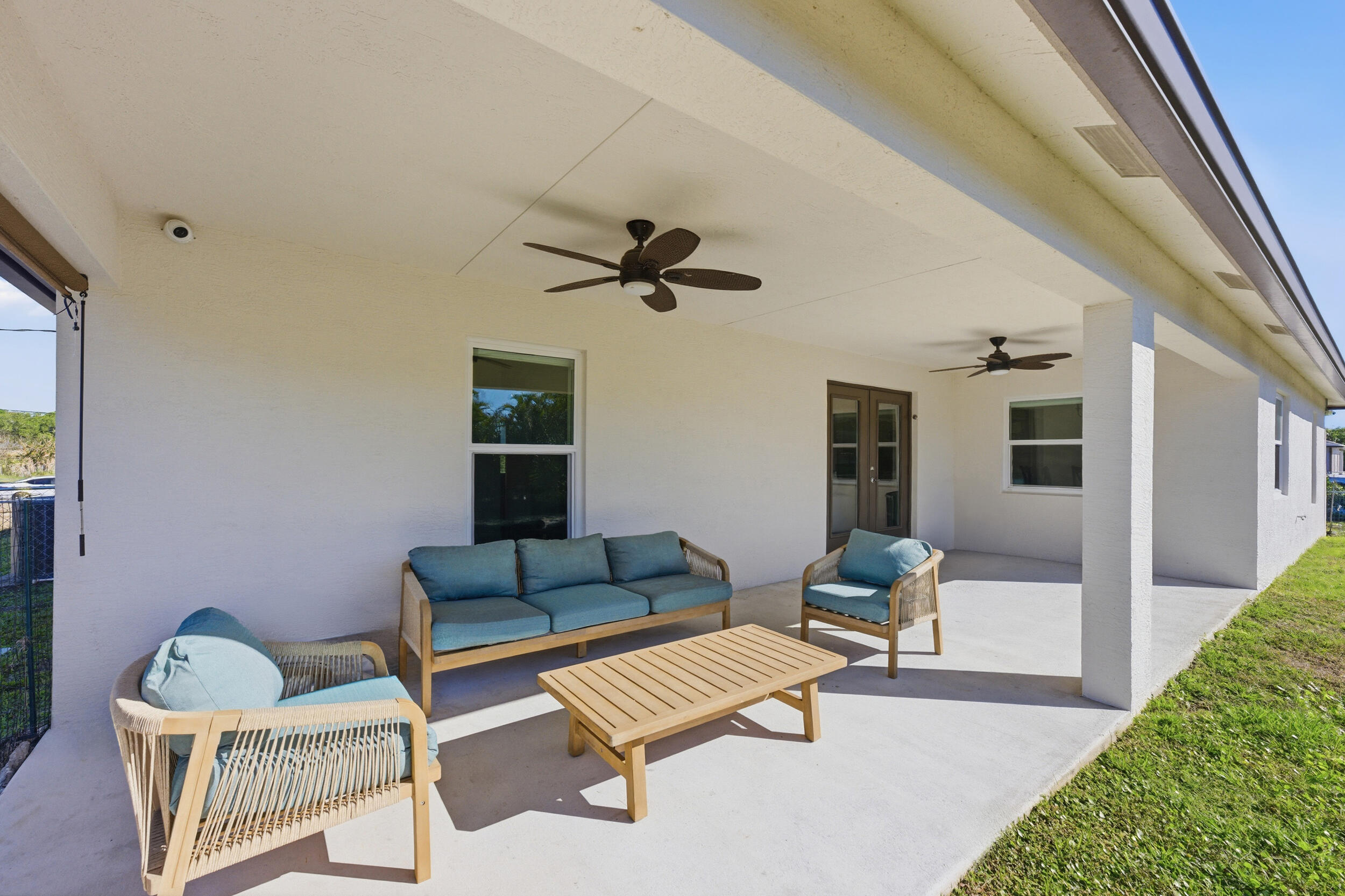 18932 42nd Road North The Acreage, FL 33470 - Photo 11 of 45 a living room with furniture and a rug
