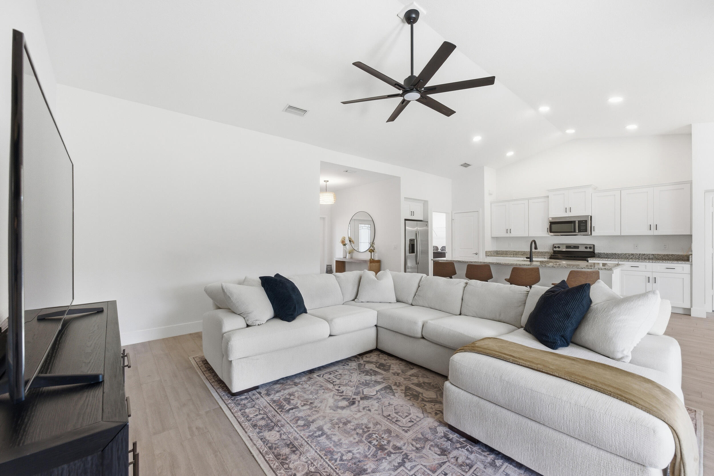 18932 42nd Road North The Acreage, FL 33470 - Photo 16 of 45 a living room with furniture and a view of kitchen