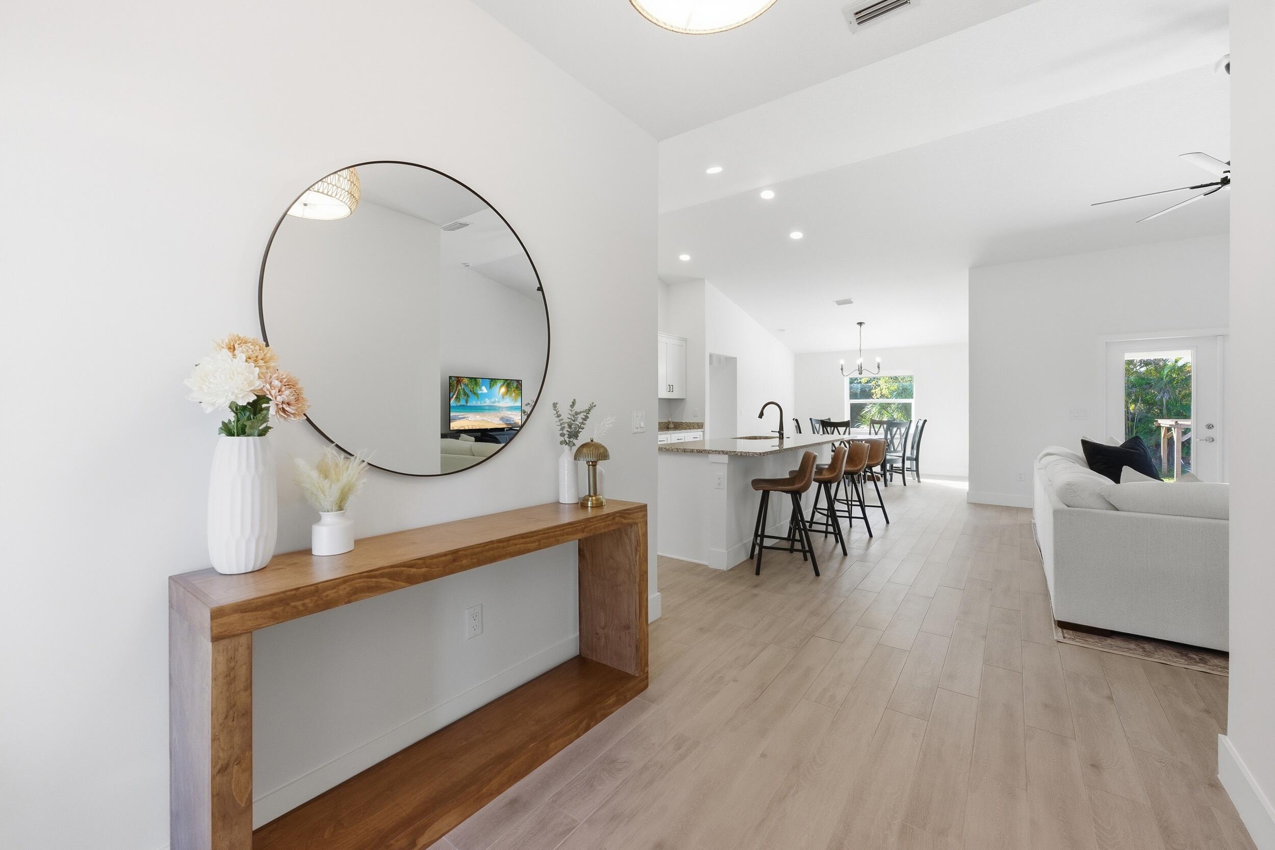 18932 42nd Road North The Acreage, FL 33470 - Photo 2 of 45 a view of a livingroom with furniture and a wooden floor