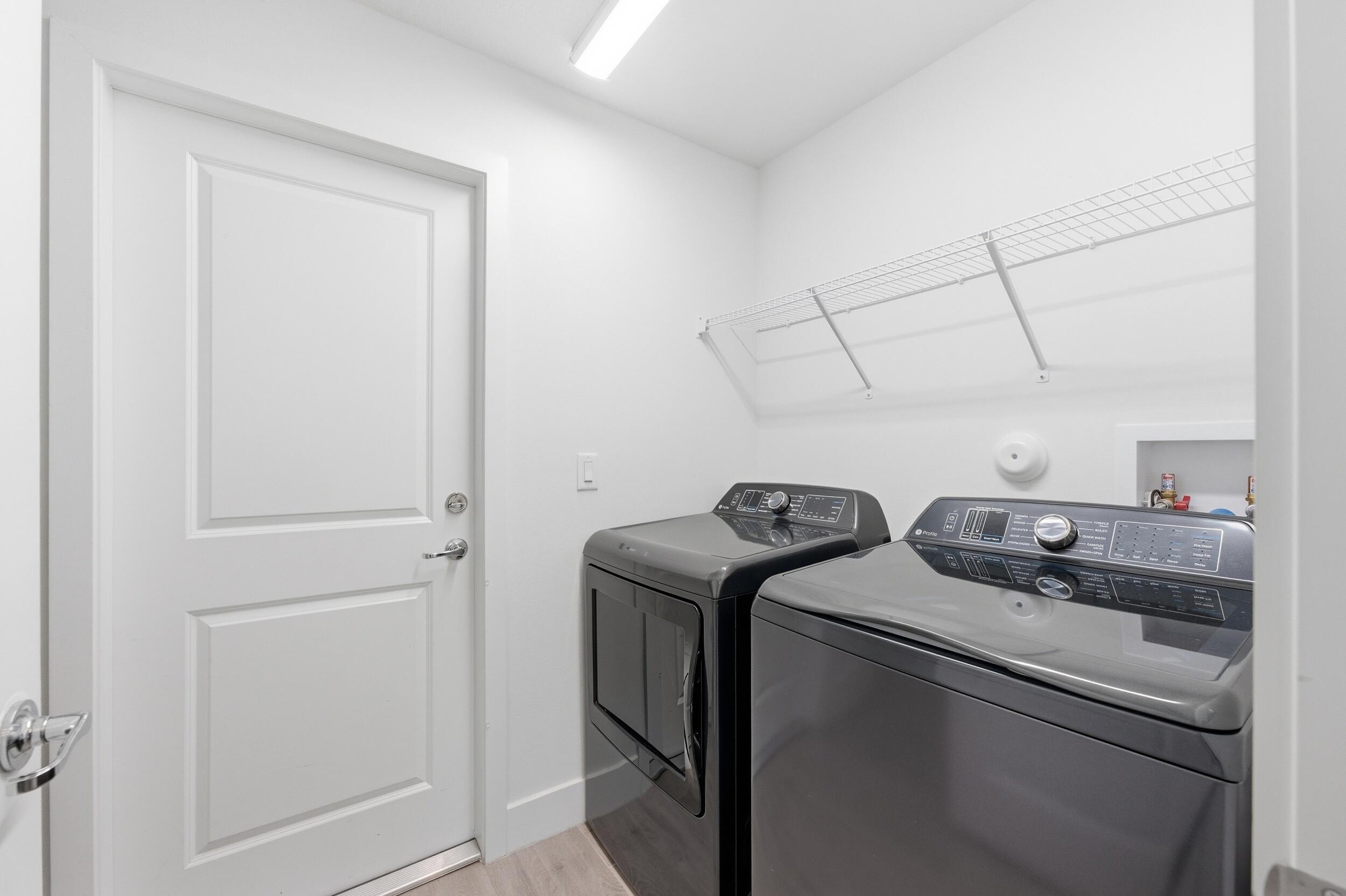 18932 42nd Road North The Acreage, FL 33470 - Photo 23 of 45 a utility room with dryer and washer