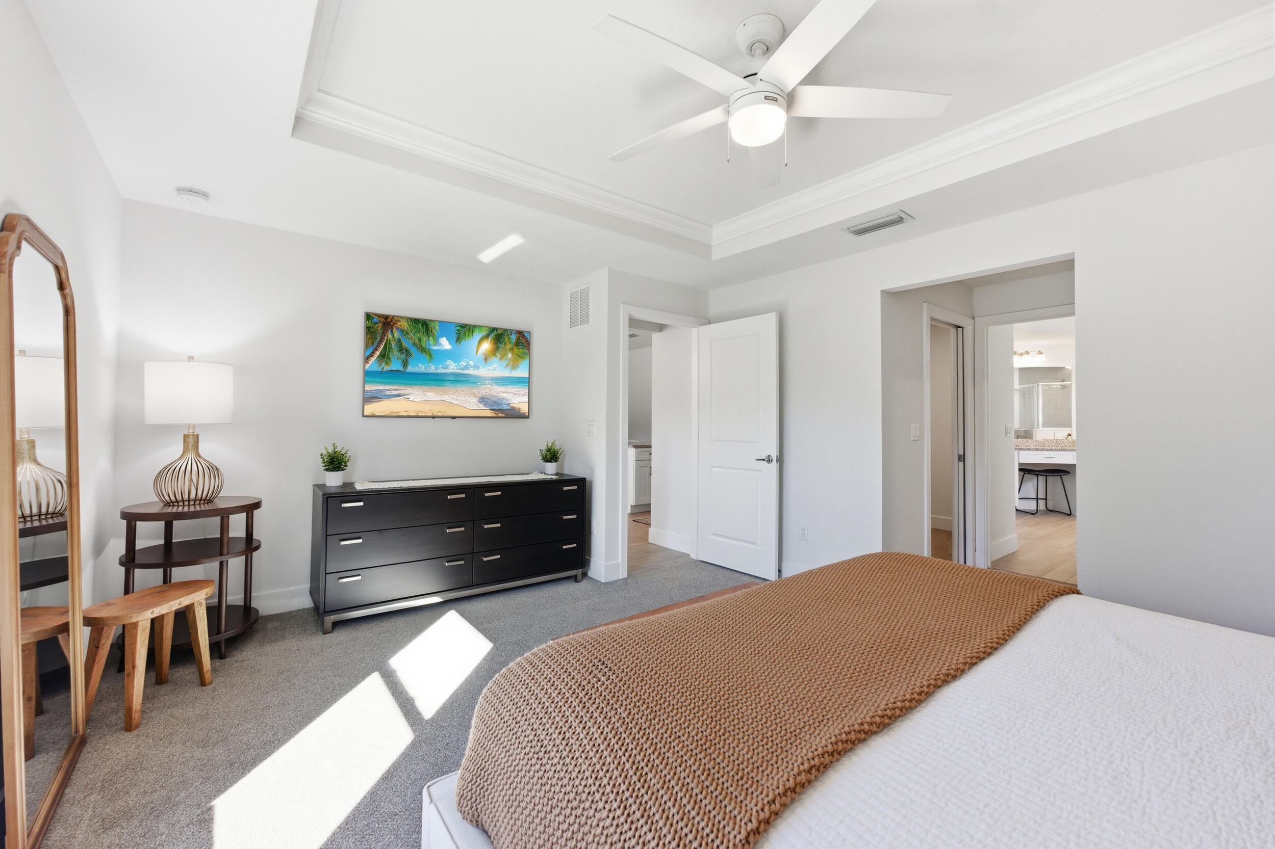 18932 42nd Road North The Acreage, FL 33470 - Photo 26 of 45 a bedroom with a bed and a chandelier