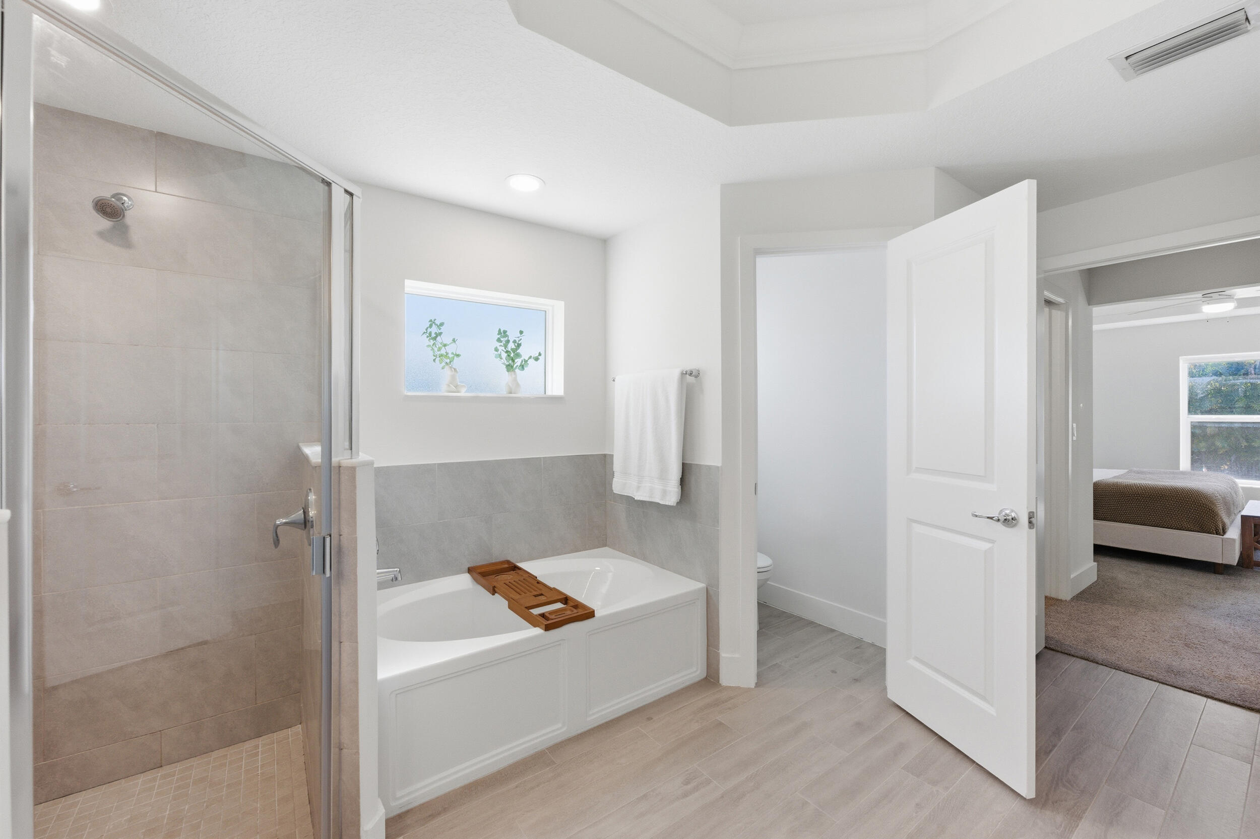 18932 42nd Road North The Acreage, FL 33470 - Photo 29 of 45 a bathroom with a tub and a shower