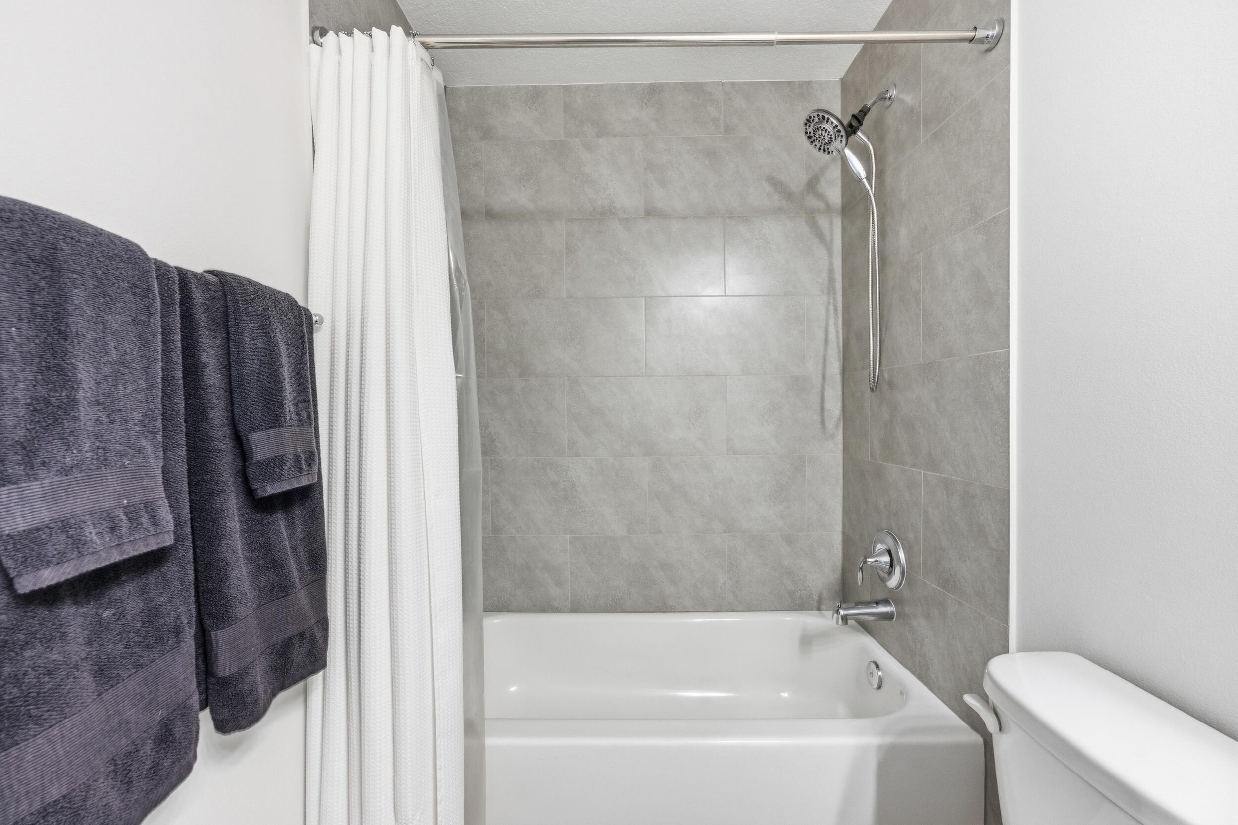 18932 42nd Road North The Acreage, FL 33470 - Photo 31 of 45 a bathroom with a bathtub and a shower
