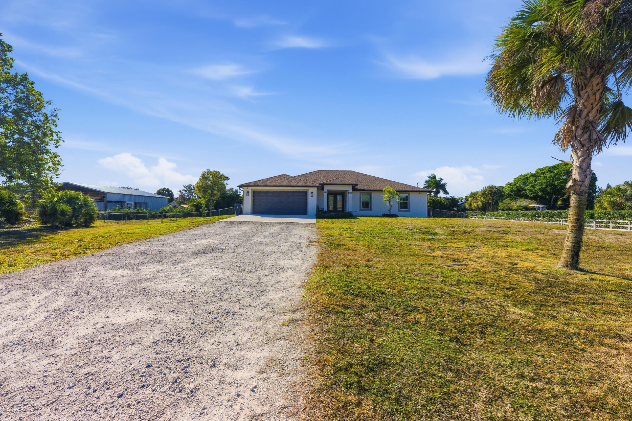 18932 42nd Road North The Acreage, FL 33470 - Photo 40 of 45 a view of an ocean with beach and swimming pool