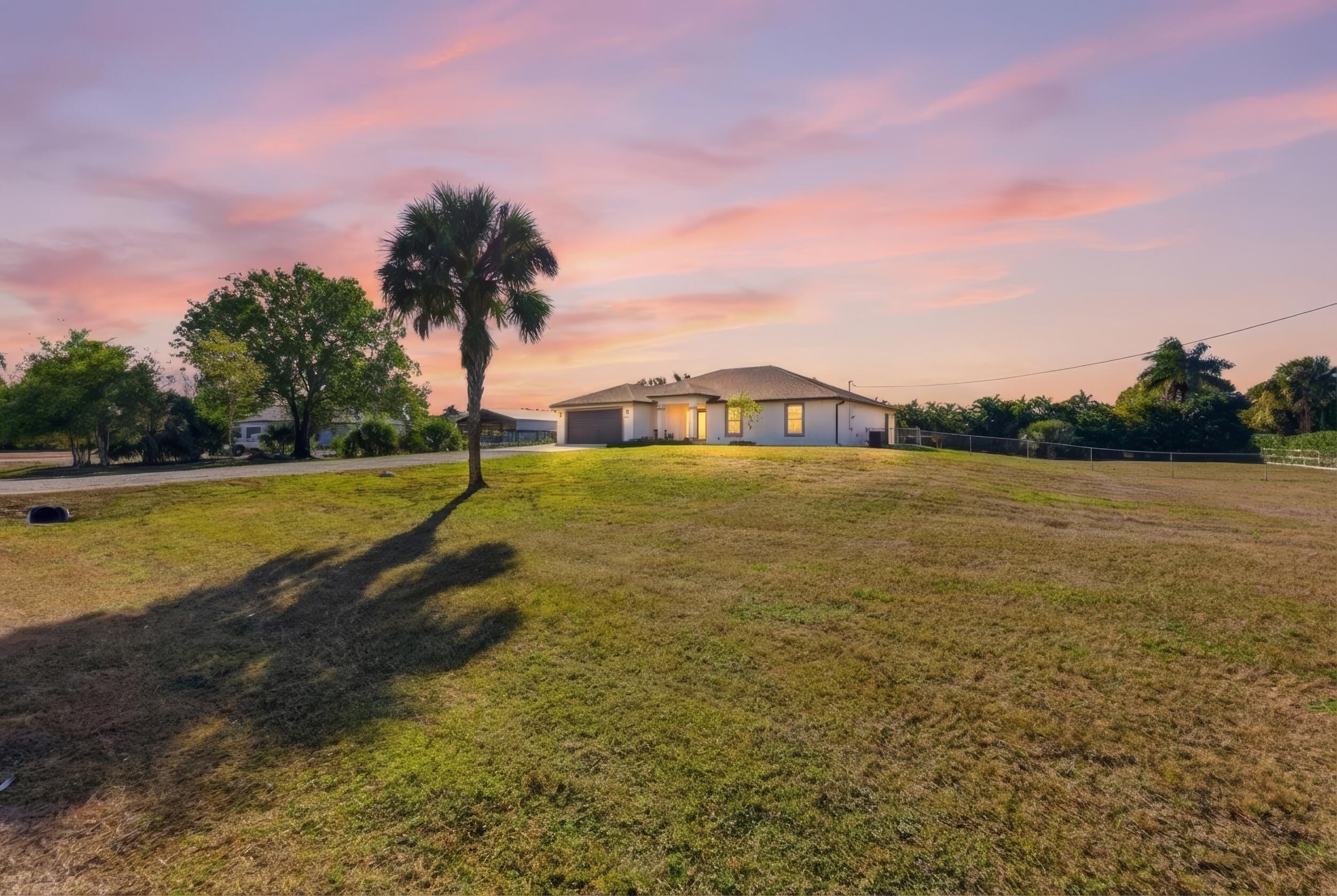 18932 42nd Road North The Acreage, FL 33470 - Photo 41 of 45 a view of a swimming pool and an outdoor space