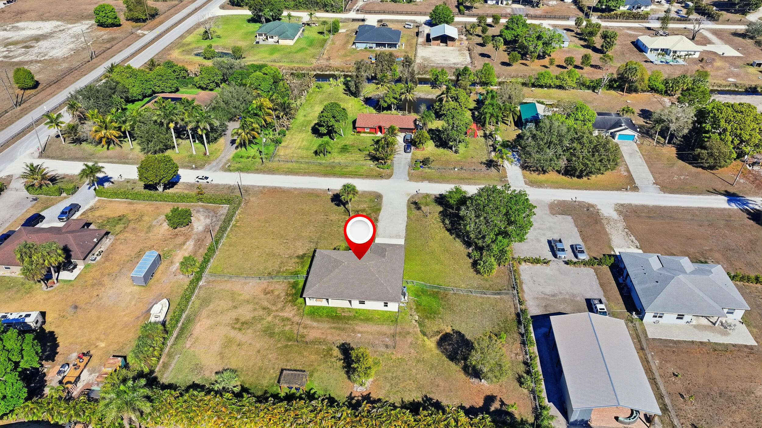 18932 42nd Road North The Acreage, FL 33470 - Photo 42 of 45 an aerial view of residential house with yard