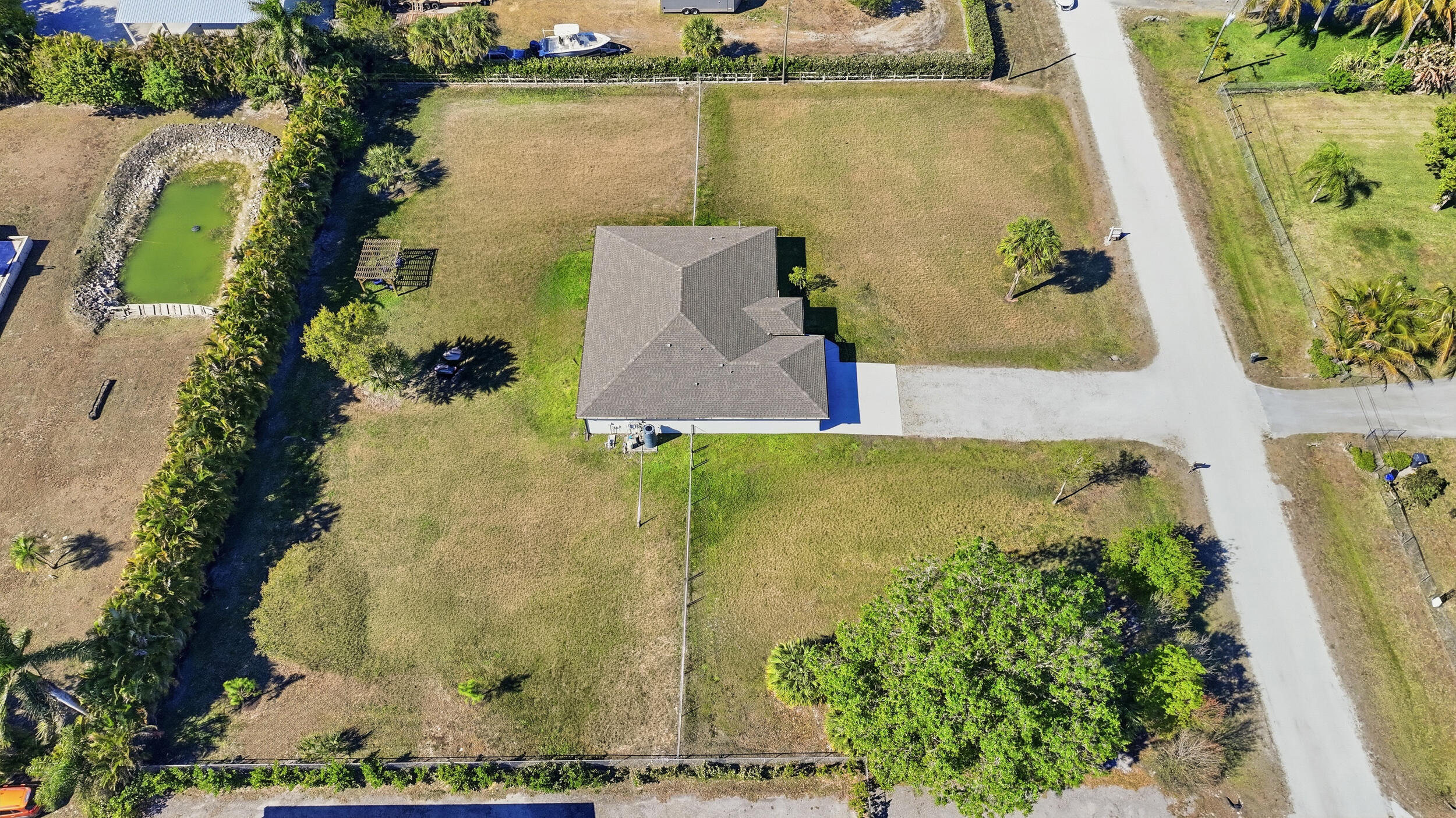 18932 42nd Road North The Acreage, FL 33470 - Photo 44 of 45 an aerial view of a residential houses with outdoor space