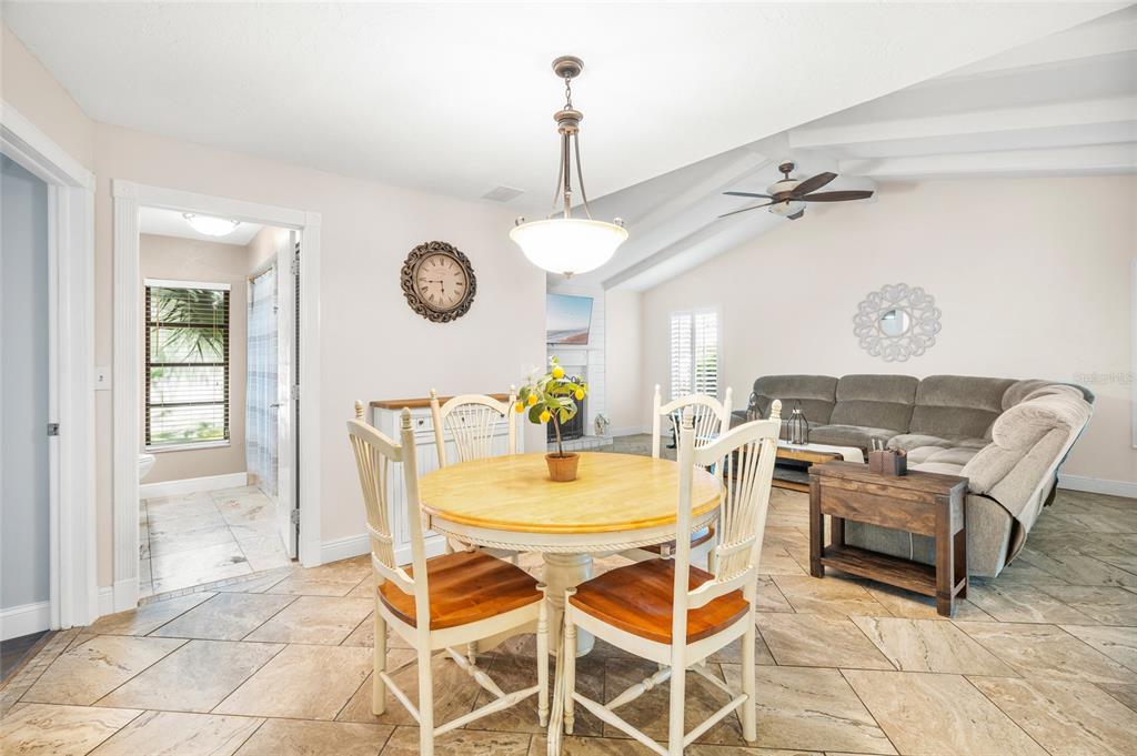 4207 Charing Cross Road Sarasota, FL 34241 - Photo 14 of 36 a view of a dining room with furniture and a chandelier