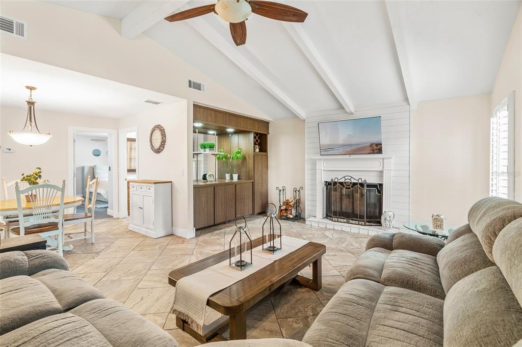 4207 Charing Cross Road Sarasota, FL 34241 - Photo 16 of 36 a living room with furniture and a fireplace