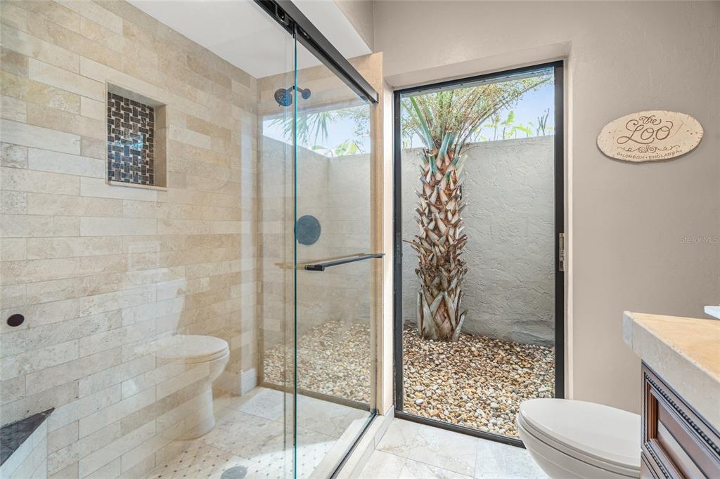 4207 Charing Cross Road Sarasota, FL 34241 - Photo 26 of 36 a bathroom with a shower toilet and sink