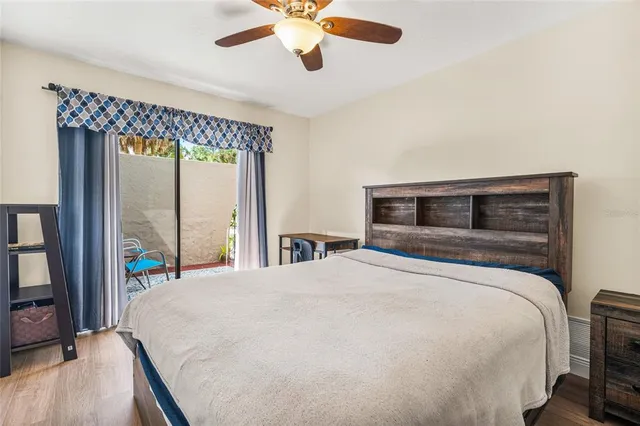 a living room with couch and a floor to ceiling window
