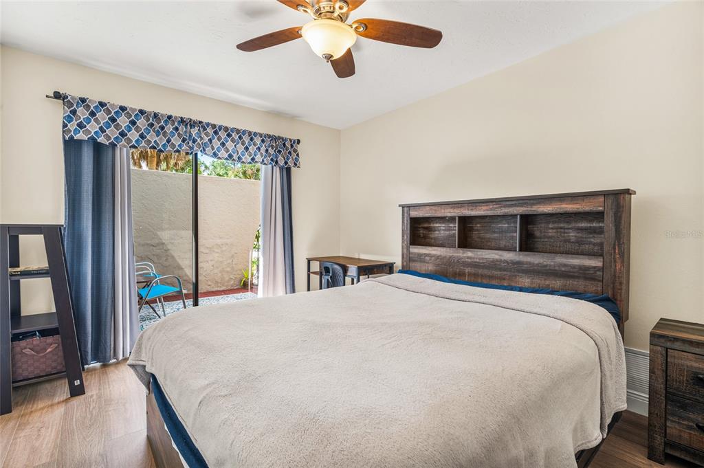 4207 Charing Cross Road Sarasota, FL 34241 - Photo 31 of 36 a bedroom with bed and a large window