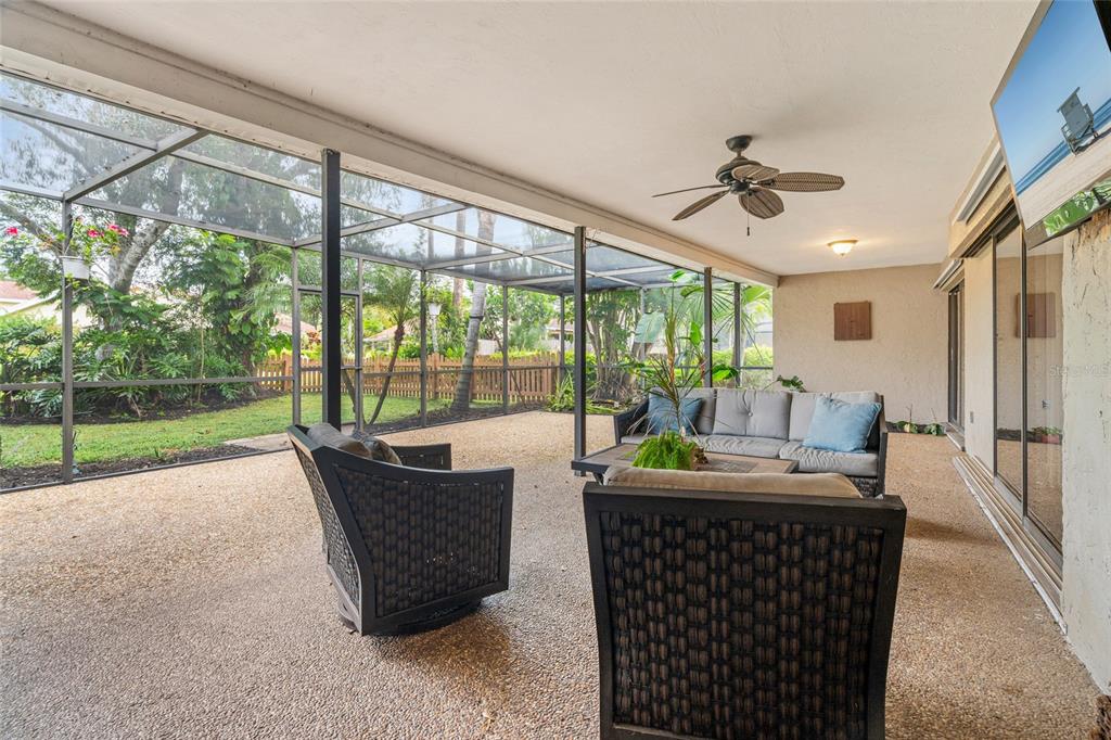 4207 Charing Cross Road Sarasota, FL 34241 - Photo 33 of 36 a living room with furniture and a floor to ceiling window