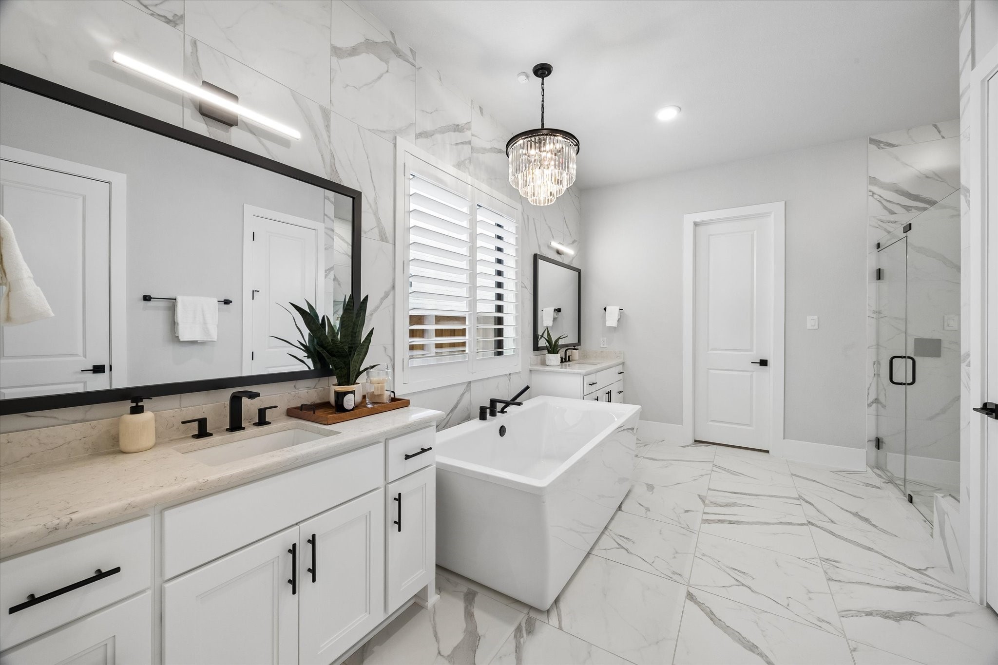 27720 Hazelbrook Lane Spring, TX 77386 - Photo 23 of 48 Your Primary Bathroom feels like a day at the spa! Large Freestanding Modern Soaking Tub with upgraded faucets and fixtures. Floor to Ceiling tile throughout & all upgraded high-end finishes