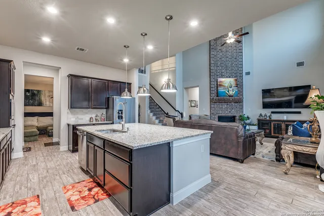 a bedroom with a bed couch and a large window