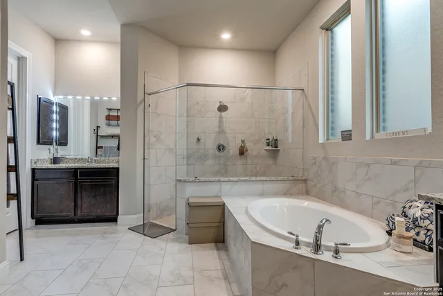 a bedroom with a bed and a mirror