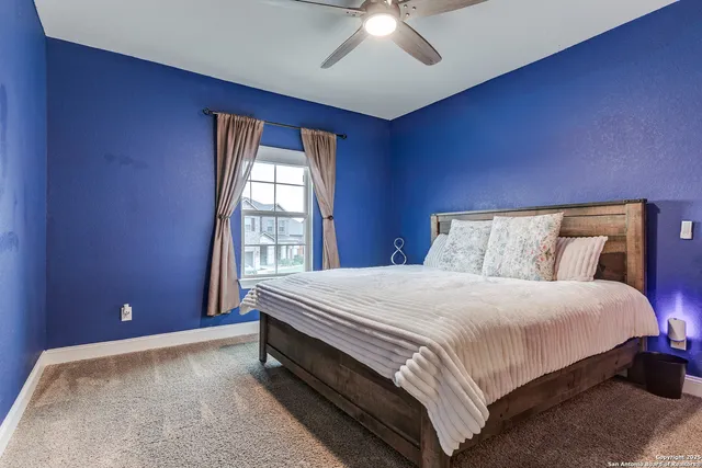 a bedroom with a bed and a fireplace