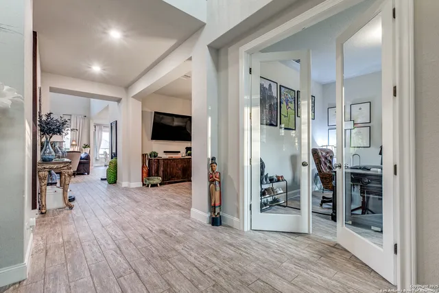 a view of a livingroom with furniture and an empty room