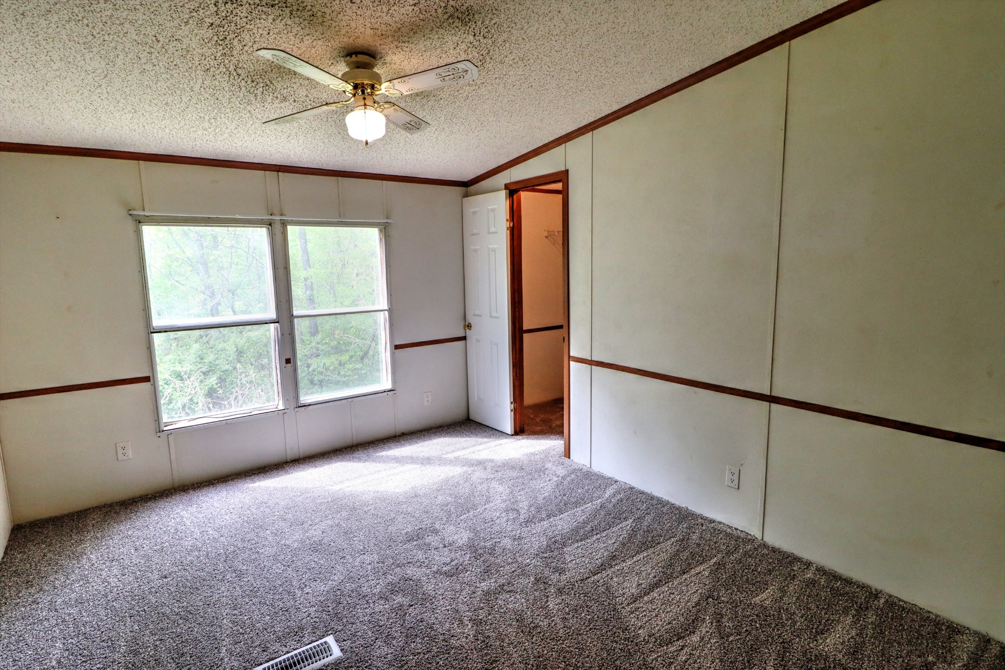 5090 Old Marion Road Cunningham, TN 37052 - Photo 15 of 21 a view of a livingroom with a ceiling fan and a window