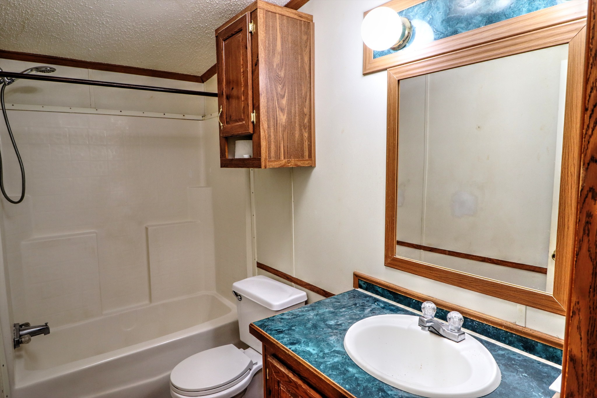5090 Old Marion Road Cunningham, TN 37052 - Photo 17 of 21 a bathroom with a granite countertop sink toilet and shower