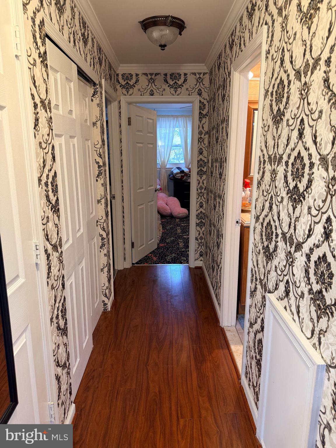 426 Parlin Street Philadelphia, PA 19116 - Photo 20 of 27 a hallway with wooden floor and staircase