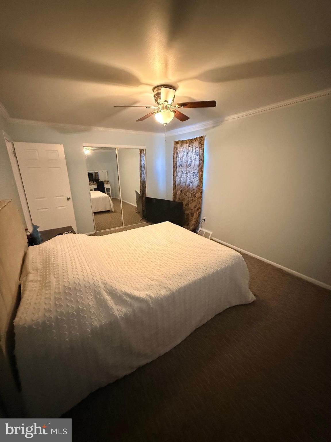 426 Parlin Street Philadelphia, PA 19116 - Photo 25 of 27 a bedroom with a bed and a chandelier