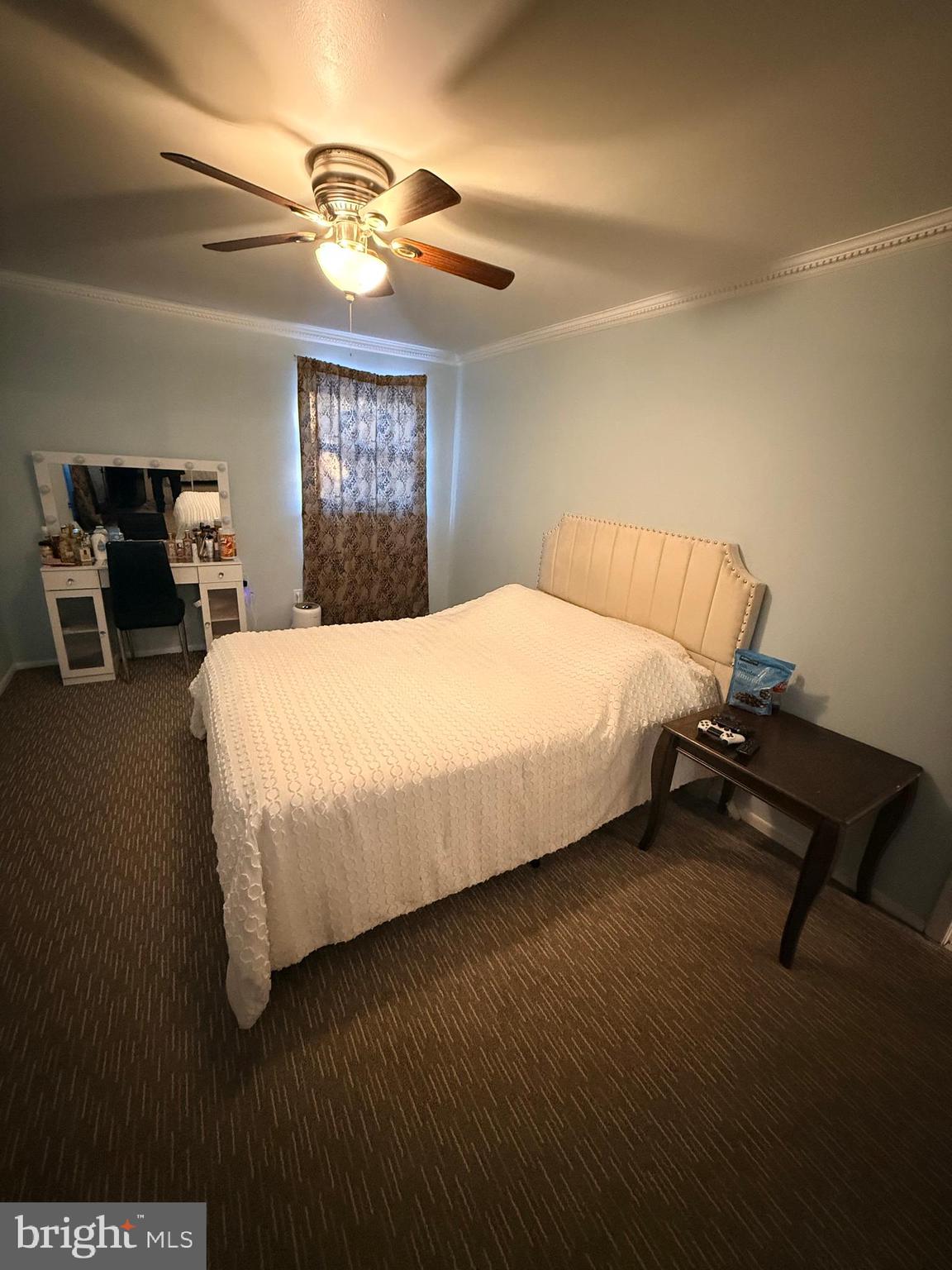 426 Parlin Street Philadelphia, PA 19116 - Photo 26 of 27 a bedroom with a bed and a chandelier