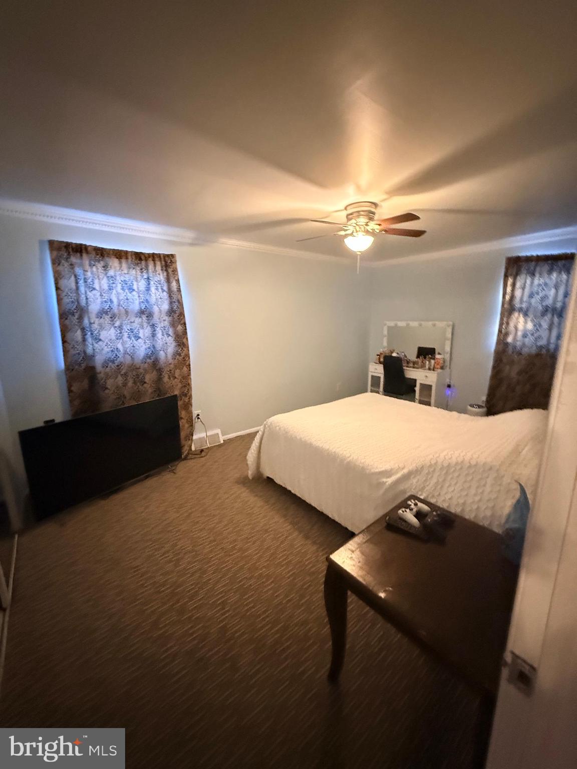 426 Parlin Street Philadelphia, PA 19116 - Photo 27 of 27 a bedroom with a bed and a chandelier