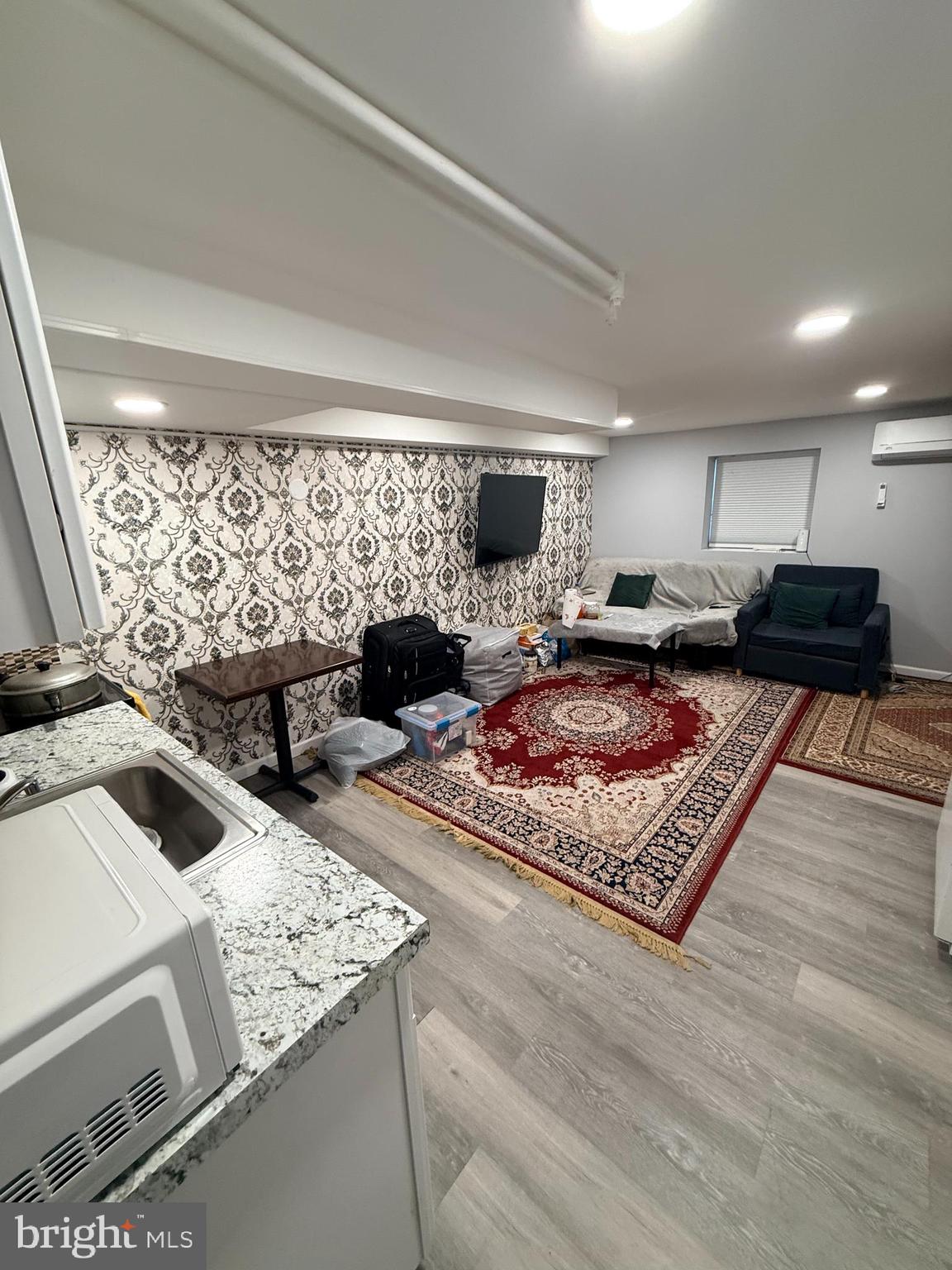 426 Parlin Street Philadelphia, PA 19116 - Photo 6 of 27 a living room with furniture and a rug