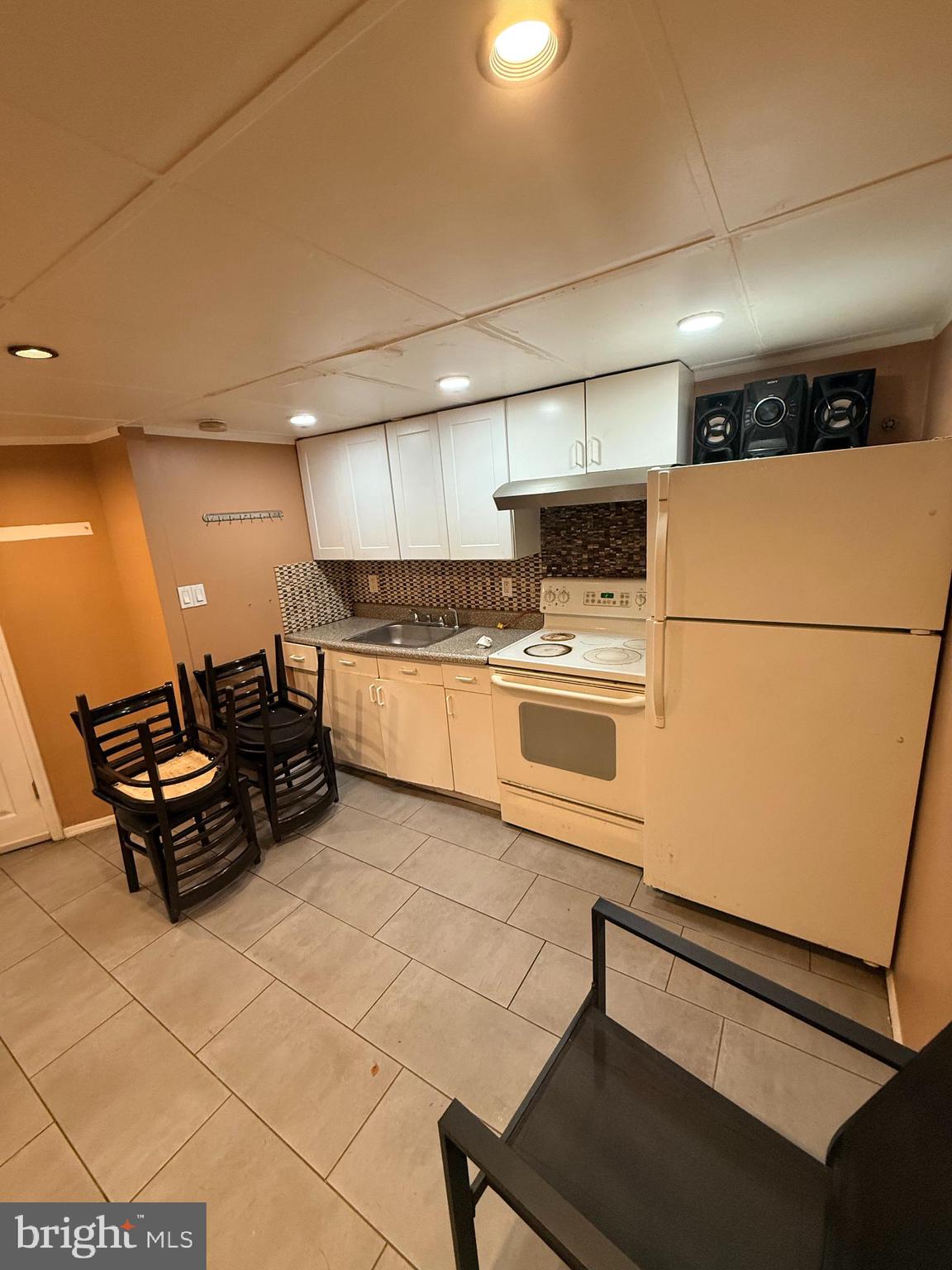 426 Parlin Street Philadelphia, PA 19116 - Photo 10 of 27 a kitchen with stainless steel appliances a refrigerator a stove a sink dishwasher and a refrigerator with wooden floor