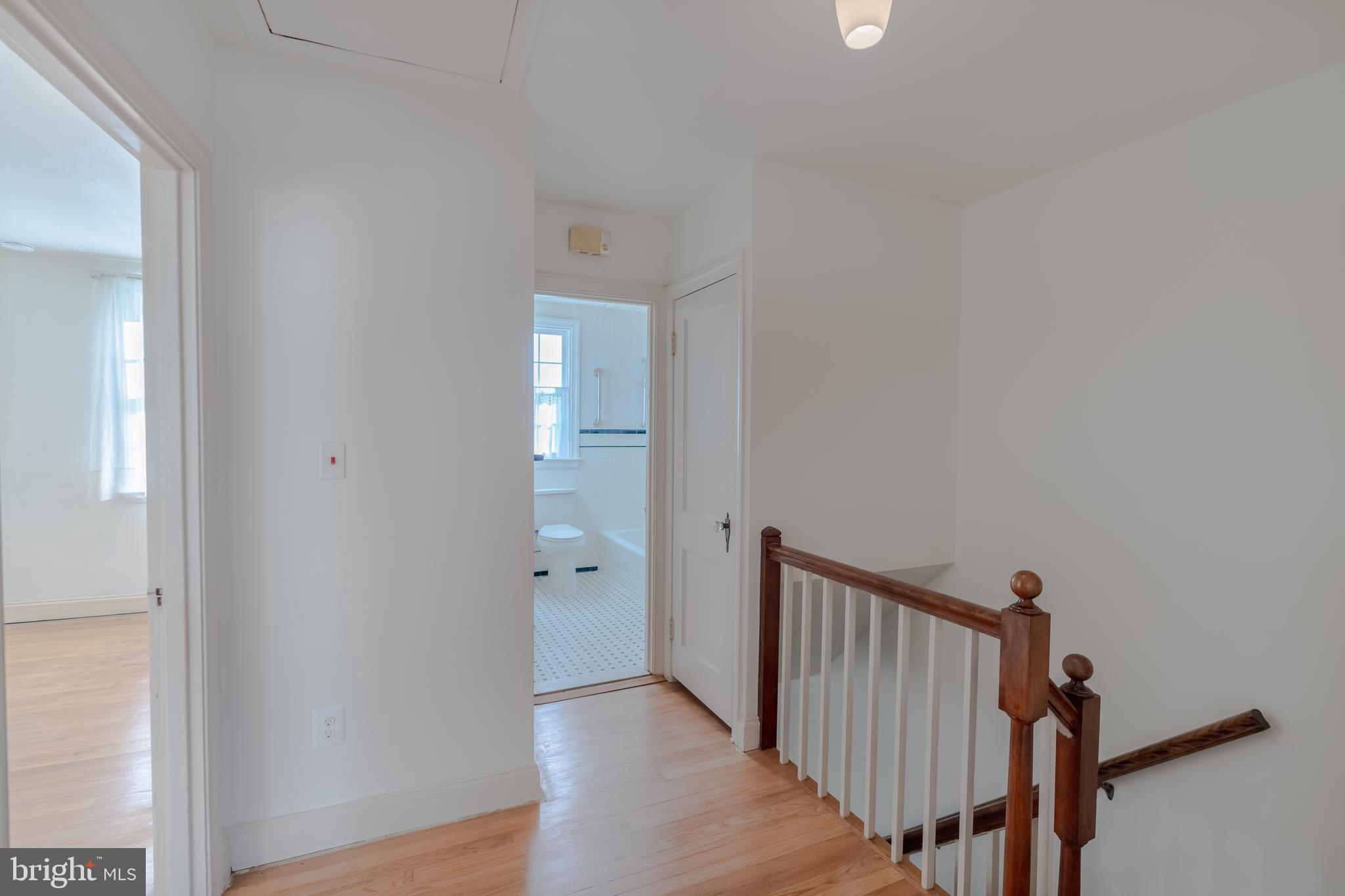 3718 Delverne Road Baltimore, MD 21218 - Photo 8 of 24 a view of a hallway with wooden floor
