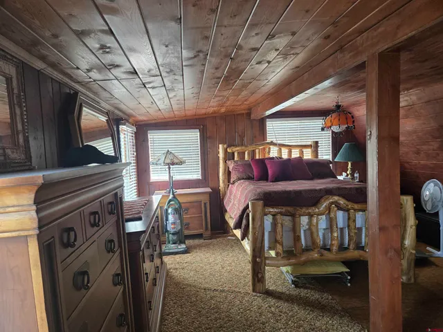 a bedroom with furniture and a window