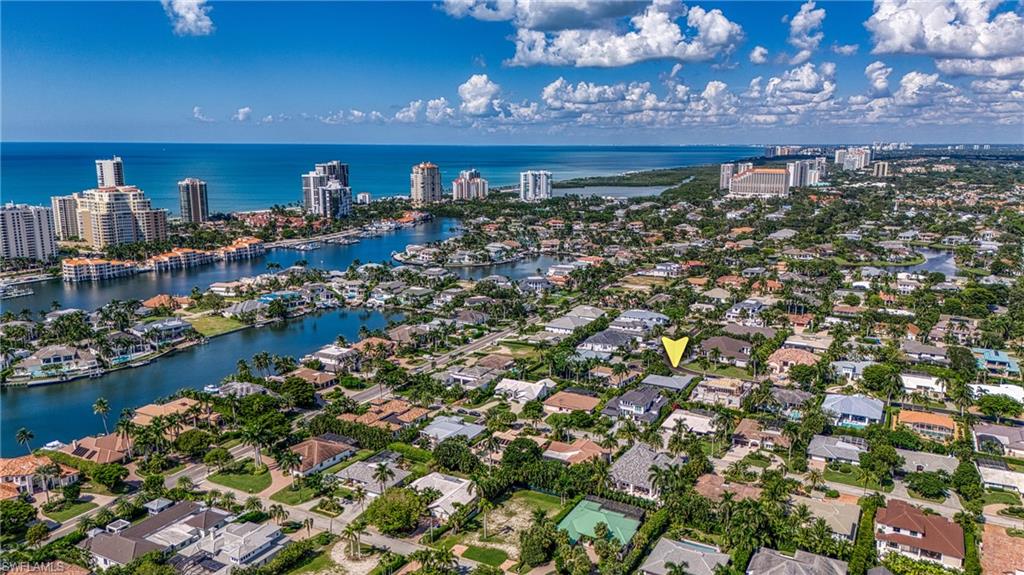 516 Neapolitan Lane Naples, FL 34103 - Photo 1 of 49 View of urban area with a large body of water