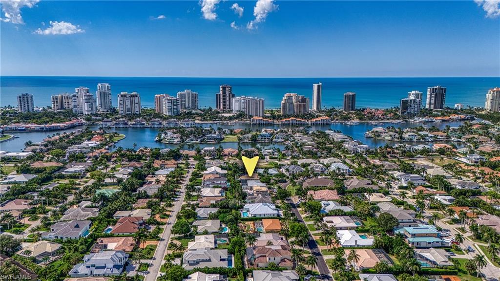 516 Neapolitan Lane Naples, FL 34103 - Photo 2 of 49 View of urban area with a nearby body of water