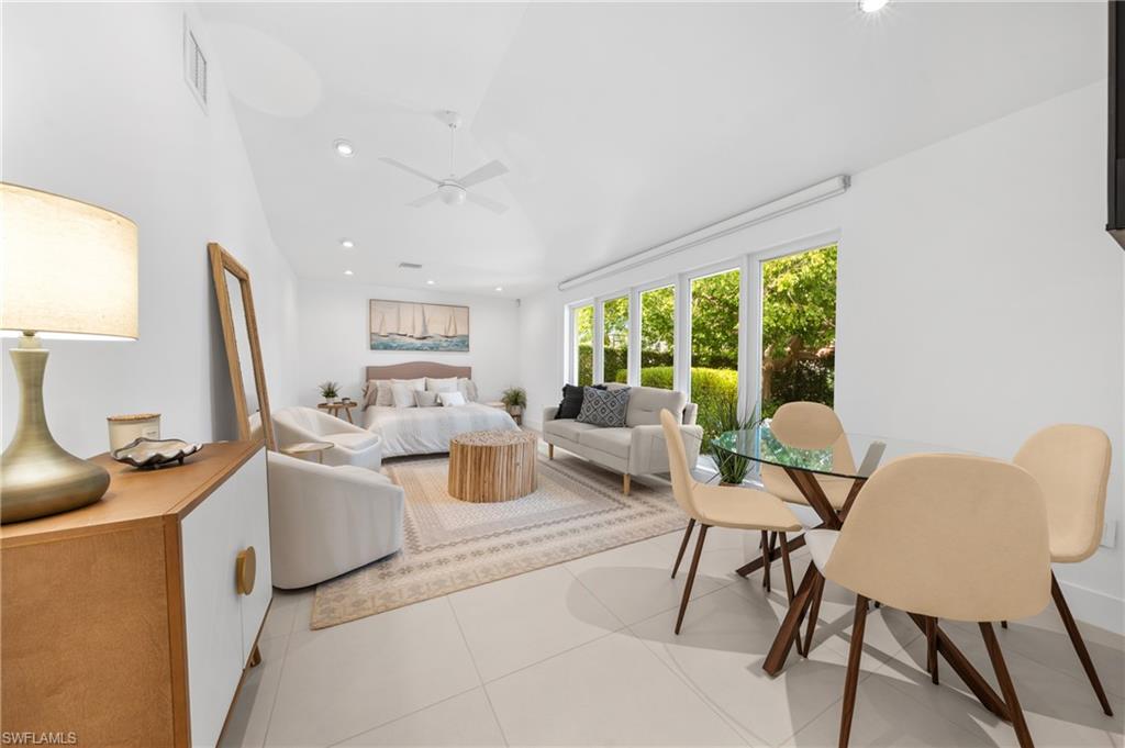516 Neapolitan Lane Naples, FL 34103 - Photo 23 of 49 Bedroom featuring recessed lighting, light tile patterned floors, and a ceiling fan