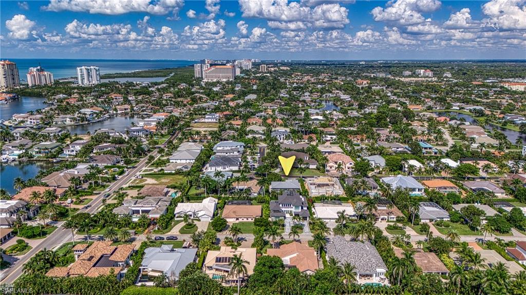 516 Neapolitan Lane Naples, FL 34103 - Photo 45 of 49 Aerial view of property's location with a nearby body of water and nearby suburban area