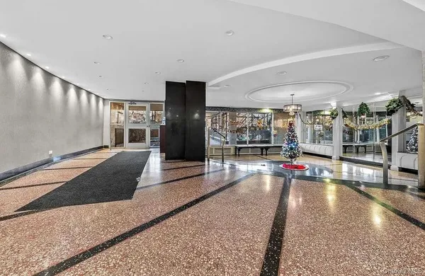 a view of a lobby with black carpet