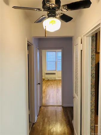 a view of an entryway with a wooden floor