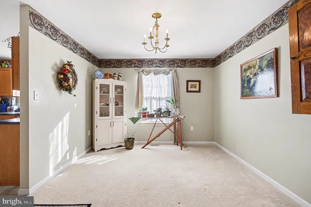 a view of a room with window and furniture